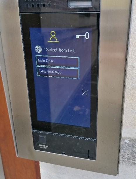 Intercom system menu screen with options to call Main Desk or Exhibition Office